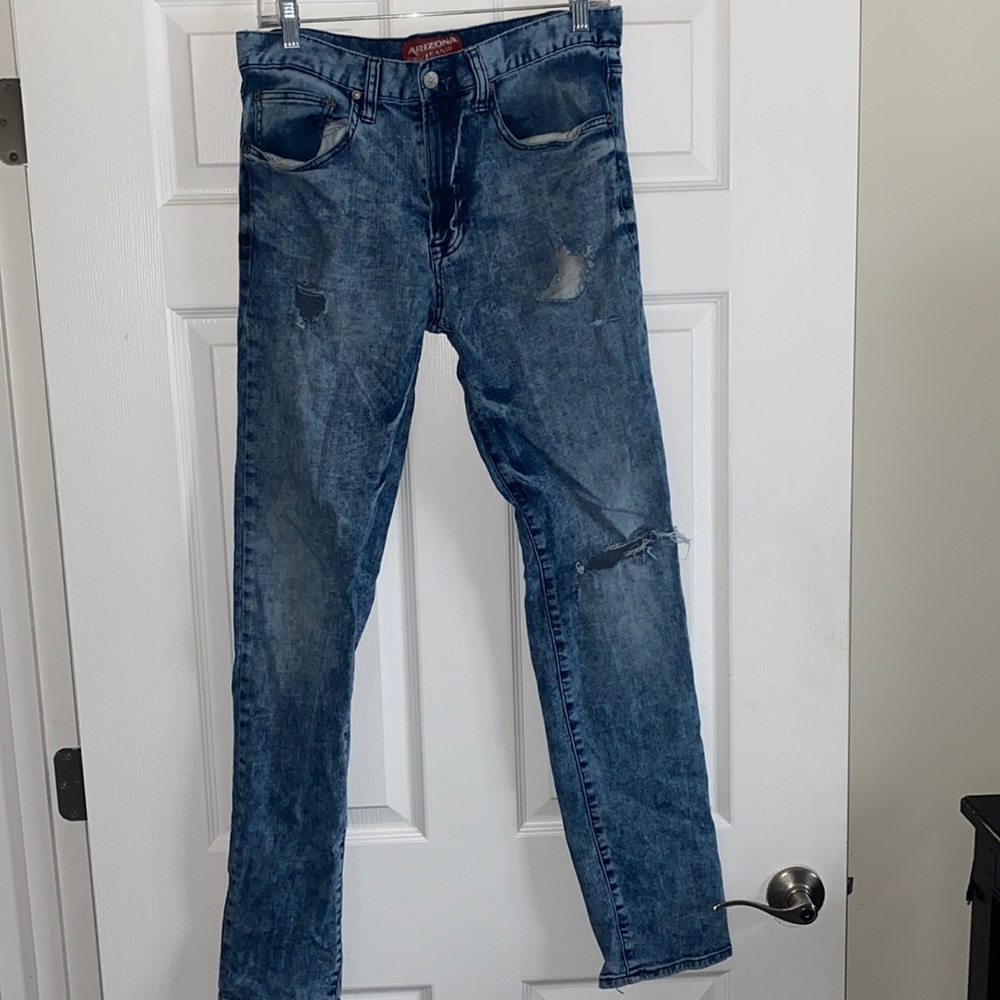 Acid wash distressed blue jeans